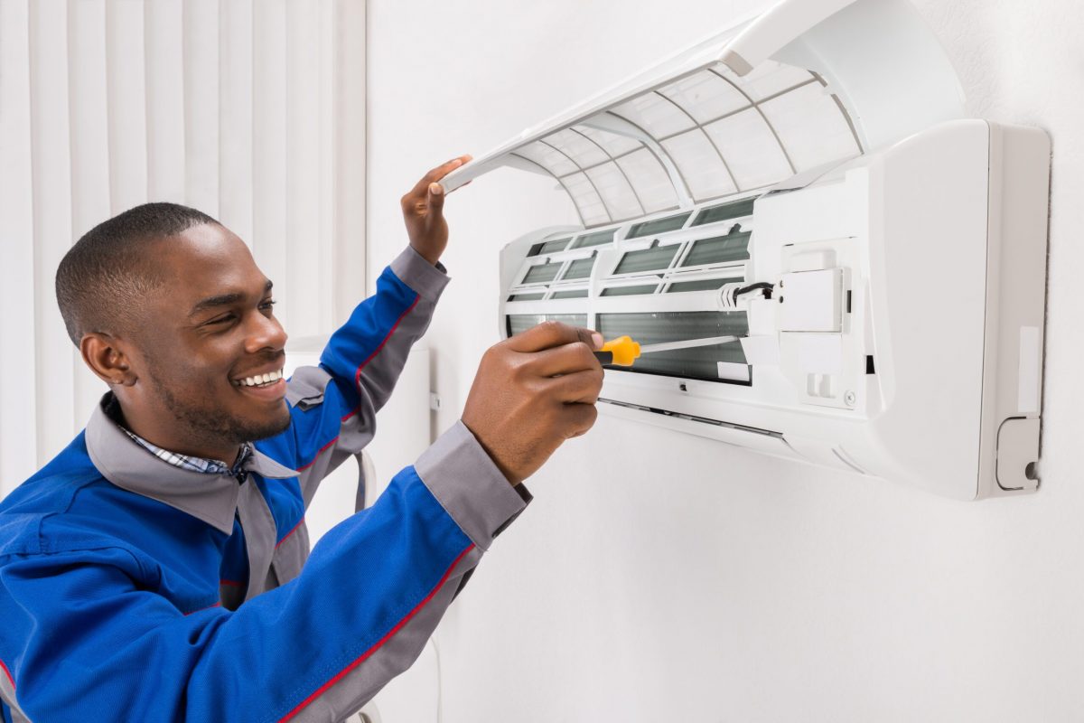 Technician Fixing AC