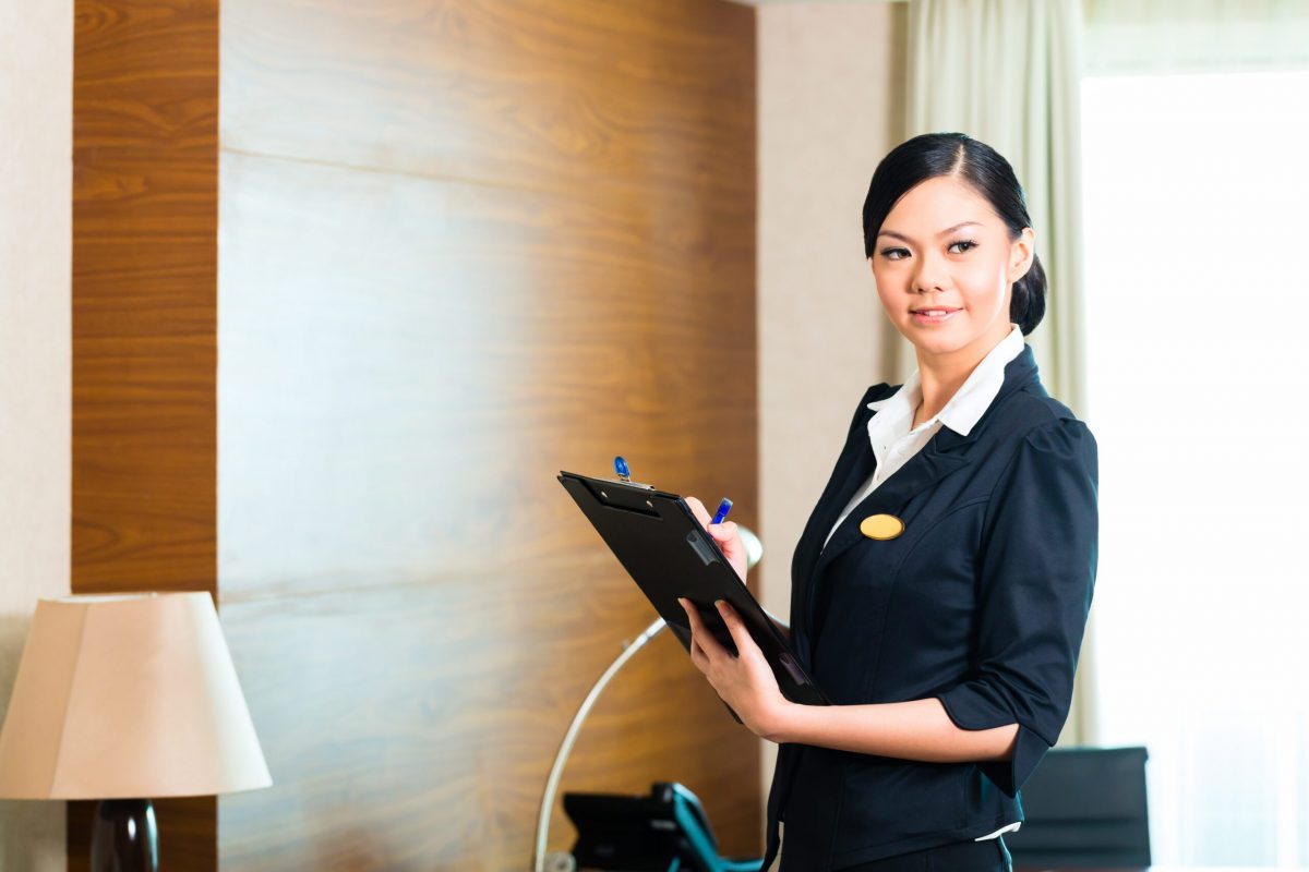 Girl in uniform holding tablet